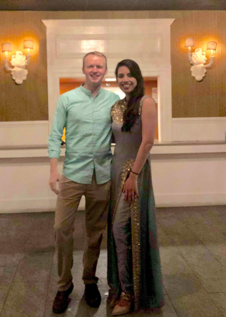 Nick and green card recipient Mehak Bhalla Grant pose at a Diwali festival.