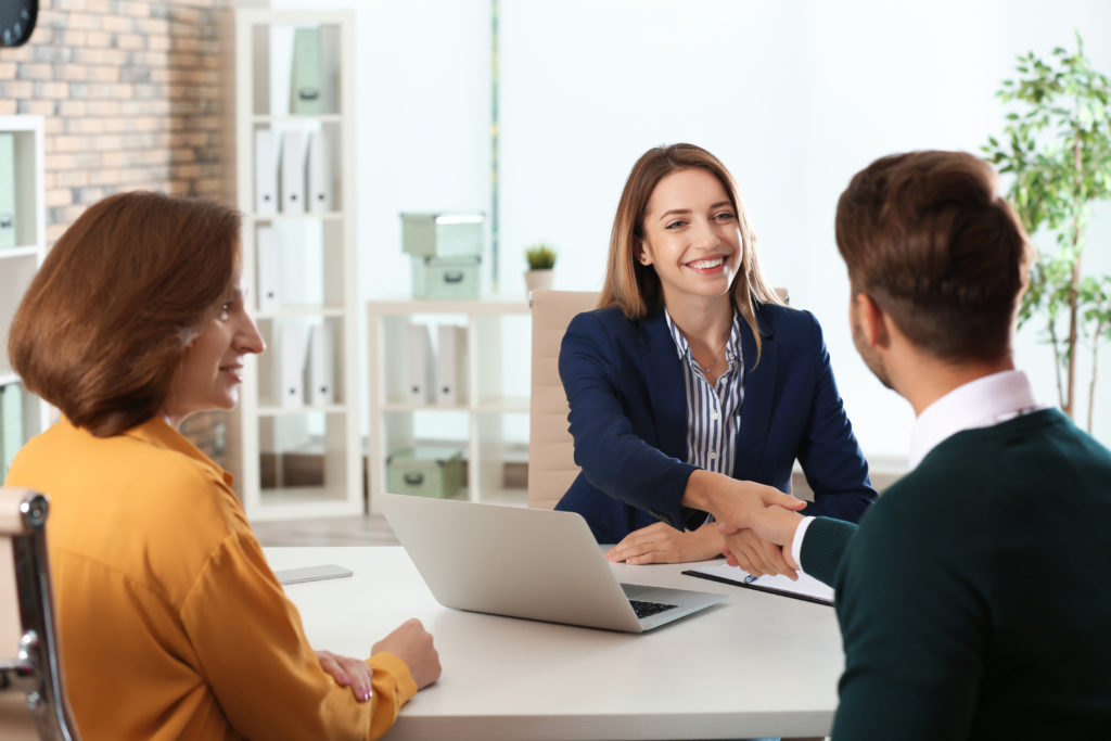 A human resource manager conducts an interview in an office